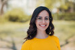 © bnenin - Head shot of a young beautiful woman with toothy smile outdoors.
