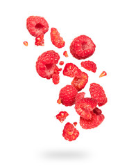 Wall Mural - Whole and sliced raspberries in the air on a white background