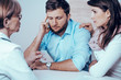 © Photographee.eu - Fertility doctor with man and women together in therapy consult session of inability to get pregnant