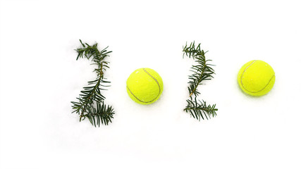 Wall Mural - Tennis Christmas and 2020 New Year concept with tennis balls and fir branches with numbers on white snow, isolated. Top view, copy space. Winter sport healthy layout. Holiday conception. Banner size.