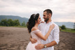 © Aleksandr - Beautiful wedding couple in Carpathian mountains. Handsome man with attractive woman