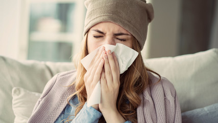 young woman suffering from cold