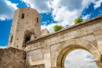 The Porta di Venere, from the Roman era, made of white travertine, with its three arches and the two towers of Properzio. In Spello, province of Perugia, Umbria, Italy.