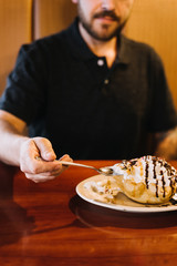 Wall Mural - Man eating Fried Ice cream