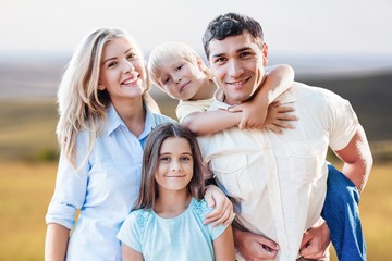 Beautiful smiling Lovely family in park