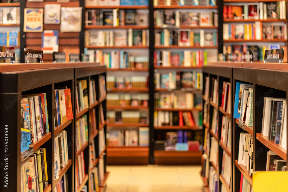 various books on shelves at a big book store Stock Photo | Adobe Stock