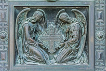 Angels With The Cross . Element Of Decorative Gates,