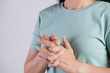 Healthcare and medical concept. Close up woman cracking knuckles.