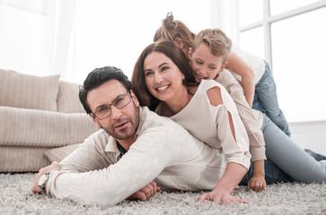 Wall Mural - happy family relaxing in comfortable living room