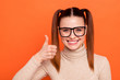 Portrait positive cheerful satisfied youngster advertise select choose decide advise tip way notice demonstrate ads trendy stylish beautiful eyewear eyeglasses turtleneck isolated orange background