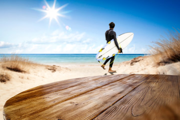 Desk of free space and summer beach background 