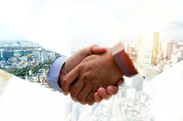 Wall Mural - Partnership. double exposure image of investor business man handshake with partner for successful meeting deal with during sunrise and cityscape background, investment, partnership, teamwork concept
