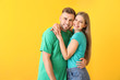 © Pixel-Shot - Portrait of happy young couple on color background