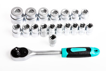 socket wrench isolated on white background. It is A Promise. various wrench heads and tips. Toolbox, tools kit detail close up. Socket Spanner Wrench. Socket set with ratchet in the toolbox.