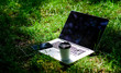 © be free - working place outdoor. Free music. summer vibes. Relax. university students life. Online shopping. agile business. Online study. laptop with headset of mobile phone and coffee to go on green grass