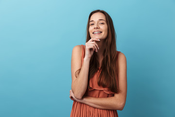 Wall Mural - Cute lovely young girl standing isolated