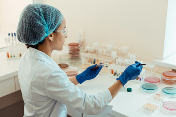 Wall Mural - intelligent smart woman working in the medical lab