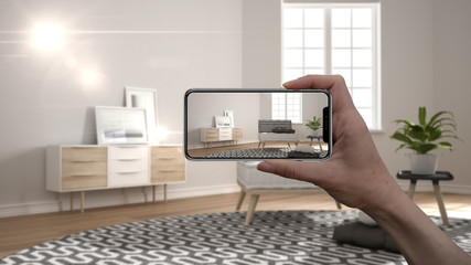 Wall Mural - hand holding smart phone, ar application, simulate furniture and interior design products in real ho