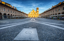 VIGEVANO, ITALY, MAY 10, 2015 - View Of Ducale Square With Ambrogio Church In Vigevano At Sunset,  Pavia Province, Italy