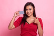 © halfbottle - Young Asian woman thumbs up with a blank card.