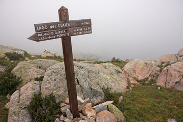 Wall Mural - indicator sign near lake claus, on the maritime alps, in italy.
