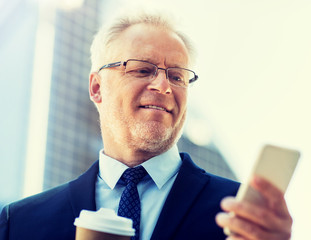 Canvas Print - business, technology, communication and people concept - senior businessman with coffee cup and smartphone in city