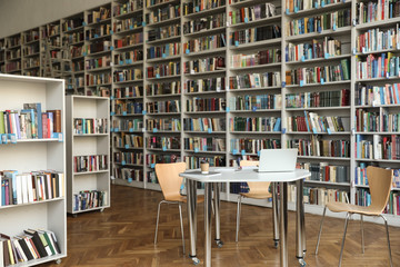 Wall Mural - View of bookshelves and table in library