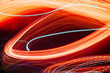 Colorful pattern of orange dynamic lines of light. Modern blurred background. Art concept of lighting effects.