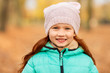 © Syda Productions - childhood, season and people concept - portrait of happy little red haired girl at autumn park