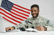© serhiibobyk - Positivity soldier of American army writing documents.