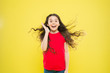 © be free - What a happy surprise. Surprised girl on yellow background. Adorable little child with surprise emotion on face. Cute small girl keeping mouth opened of big surprise. Being pleased with surprise