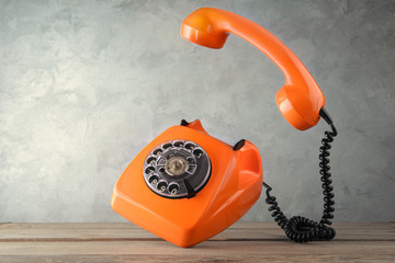 Vintage orange phone - levitate over the table