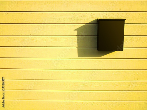 Dark Brown Mailbox On Bright Yellow Wooden Wall Buy This Stock Photo And Explore Similar Images At Adobe Stock Adobe Stock