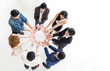 © paulaphoto - Creative team meeting hands synergy brainstorm business man woman in circle top view on white background. Support teamwork acquisition together international diversity harmony people concept banner