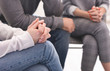 © Prostock-studio - People sitting at support group meeting, close up