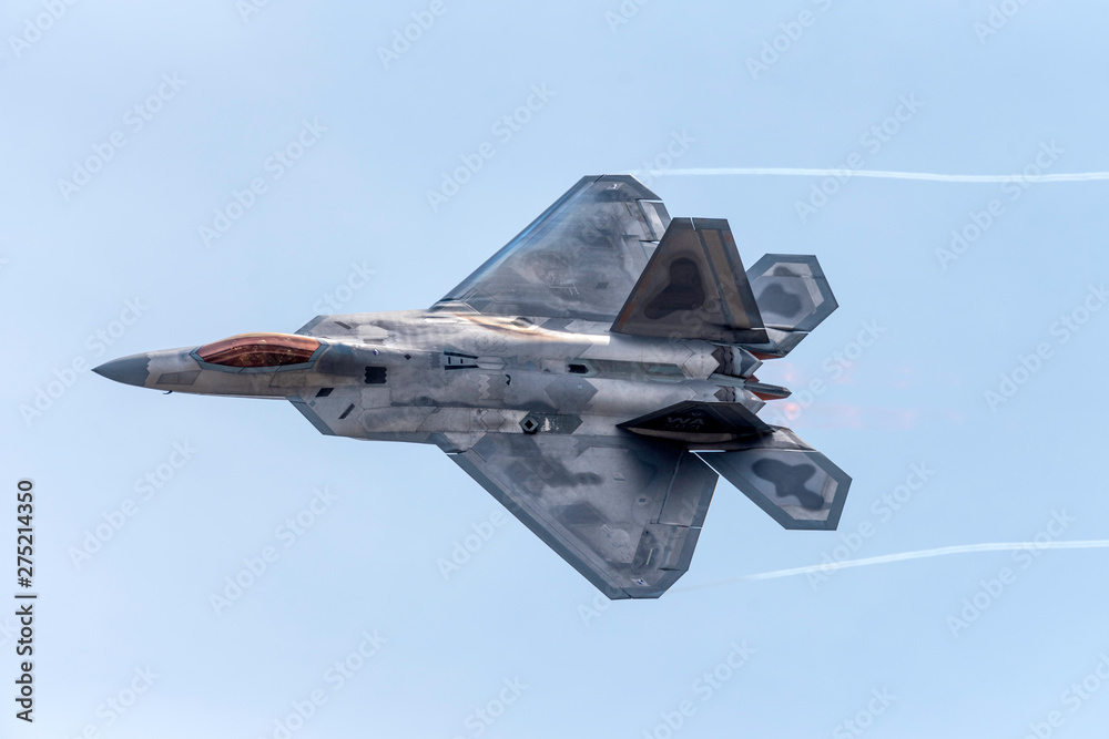 Advanced Tactical Fighter Jet Against Blue Skies - obrazy, fototapety, plakaty 