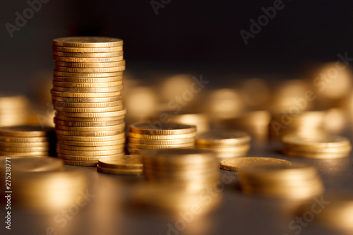 Cuadros en Lienzo Stack of Gold Coin on Black Background.