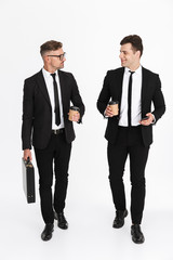 Wall Mural - Two attractive confident businessmen wearing suits