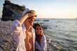 © NDABCREATIVITY - Romantic couple in love enjoying vacation on beach at summer