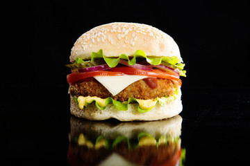 Delicious fast food. Burger on a wooden board