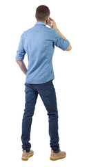 Poster - back view of a man talking on the phone