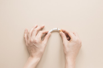 Wall Mural - Top view hands breaking a cigarette