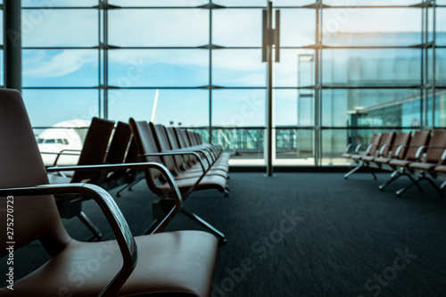 Passenger Seats In Departure Lounge At Airport Terminal