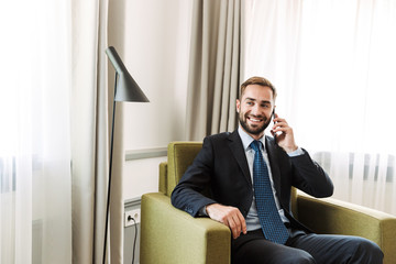 Wall Mural - Attractive young businessman wearing suit