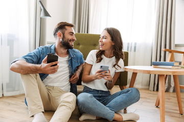 Wall Mural - Beautiful young couple in love at home