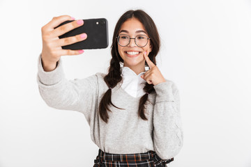 Wall Mural - Attractive schoolgirl wearing unifrom standing