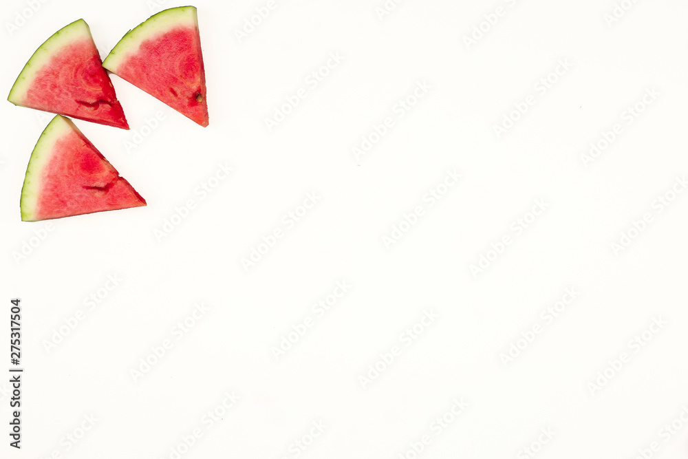 Triangular isolated slices of watermelon forming geometric games for copy space on a white background - obrazy, fototapety, plakaty 