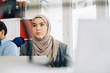 © Alder - Young businesswoman working in office