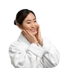 Wall Mural - Portrait of beautiful Asian woman in bathrobe isolated on white. Spa treatment