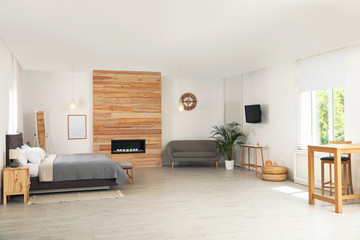 Wall Mural - Stylish studio apartment interior with comfortable furniture